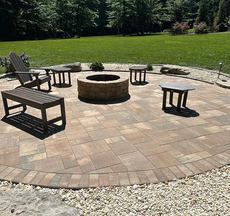 brick outdoor fire pit surrounded by outdoor chairs over a stone patio in kernersville, nc brick outdoor fire pit surrounded by outdoor chairs over a stone patio in kernersville, nc<br />