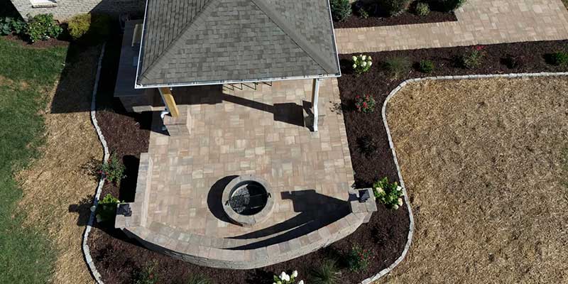 drone shot of an above-ground fire pit in a residential property in Kernersville by the santos hardscape & tree services team<br />
