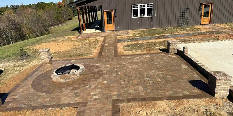 wood burning fire pit on a stone patio in a residential property in Kernersville, NC