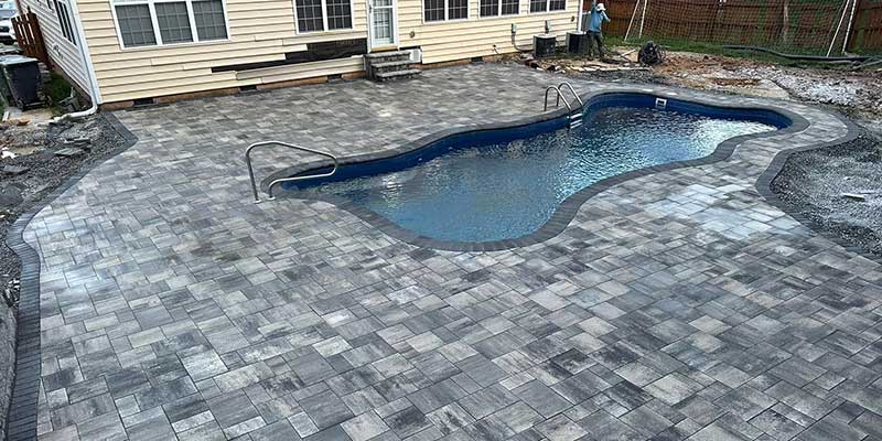 stamped concrete pool deck under construction by the santos hardscape & tree service team<br />

